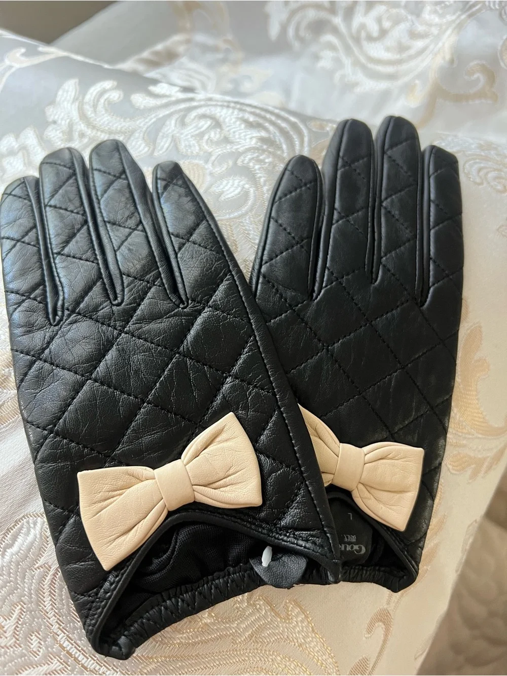 Black Quilted Leather Gloves with Beige Bow Accent